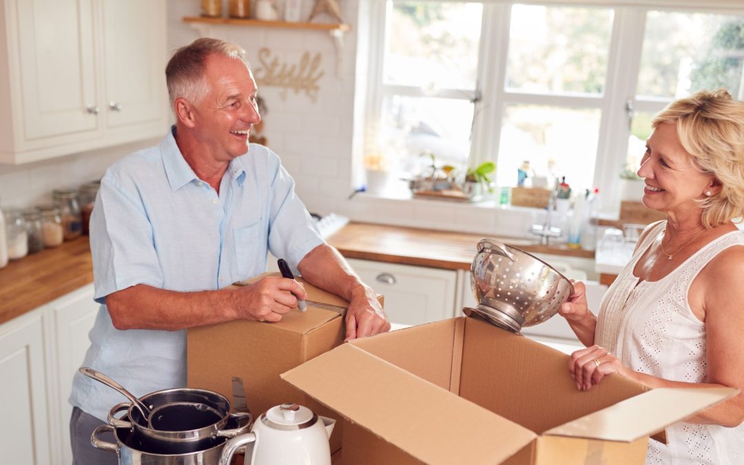 Homeowner packing boxes while downsizing before a move